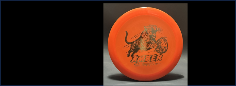 An orange Latitude 64 Opto Amber with a cool Leopard stamp.